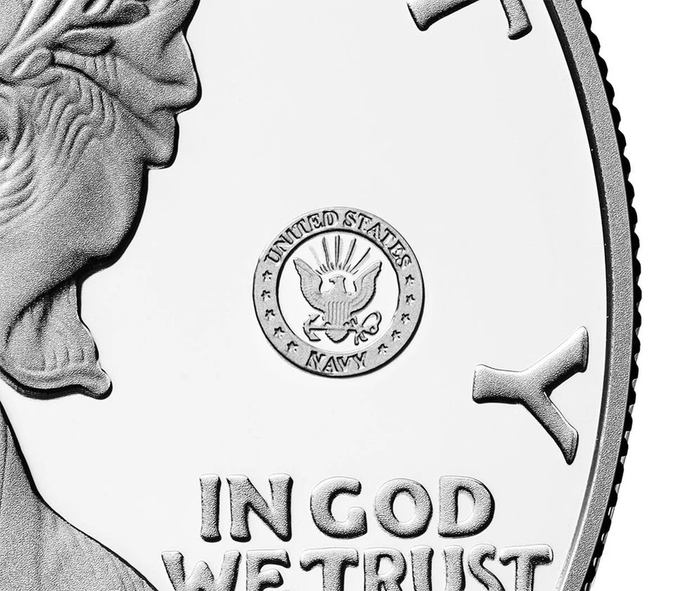Close up of the American eagle silver dollar featuring the US Navy 250th anniversary privy mark consisting of a circular emblem that reads 'UNITED STATES NAVY' surrounding the Navy insignia.